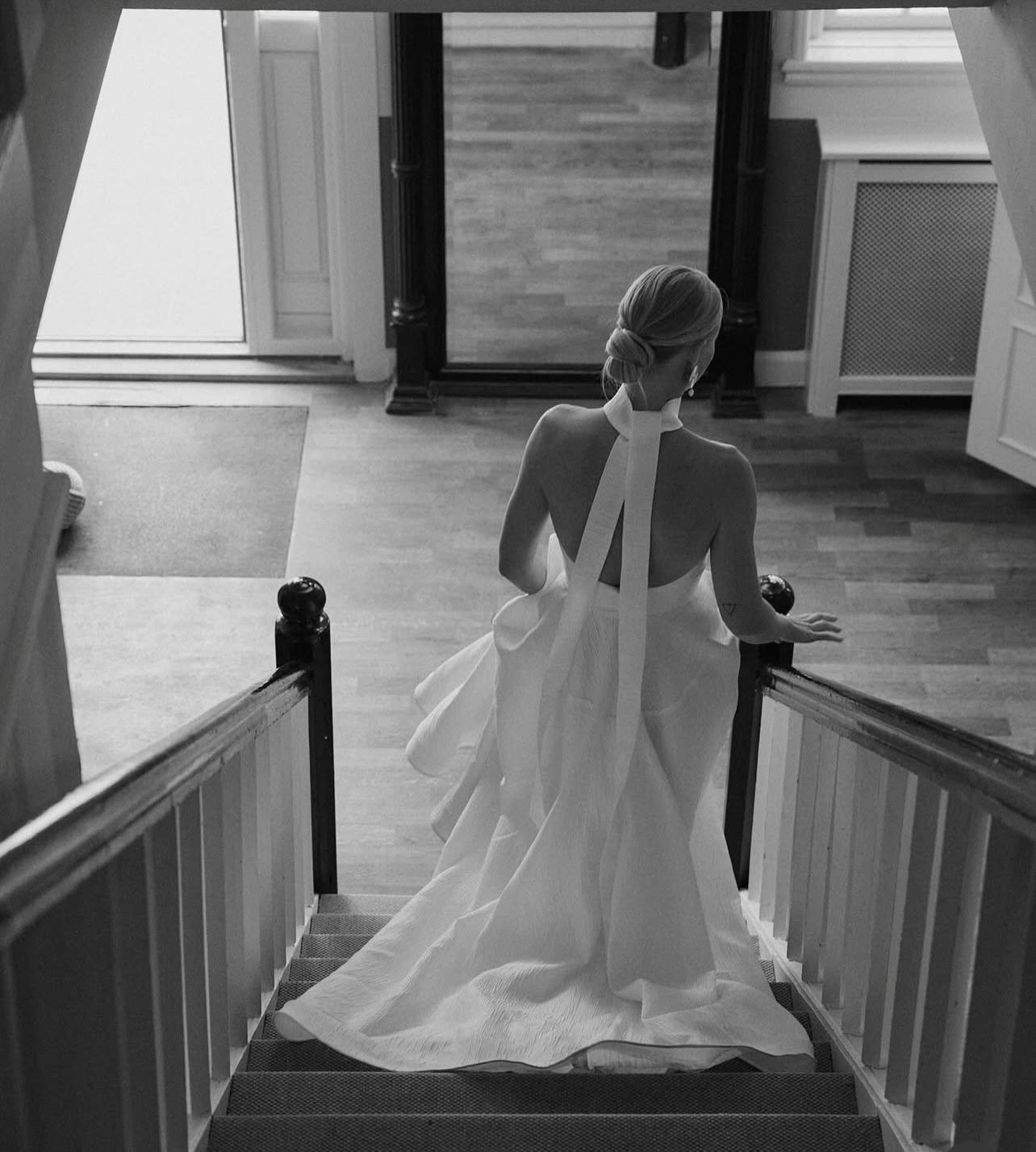 A bride descending a staircase before the ceremony